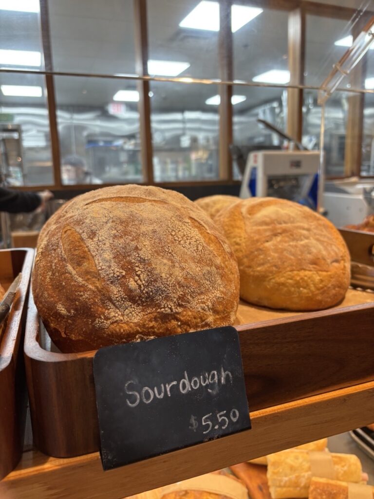 Freshly sliced sourdough bread showing a perfect airy texture and golden crust