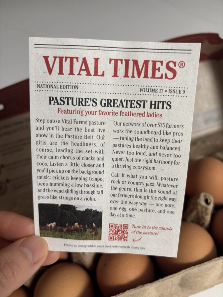 Vital Farms Pasture-Raised Organic Eggs in a black carton with Happy Hens logo