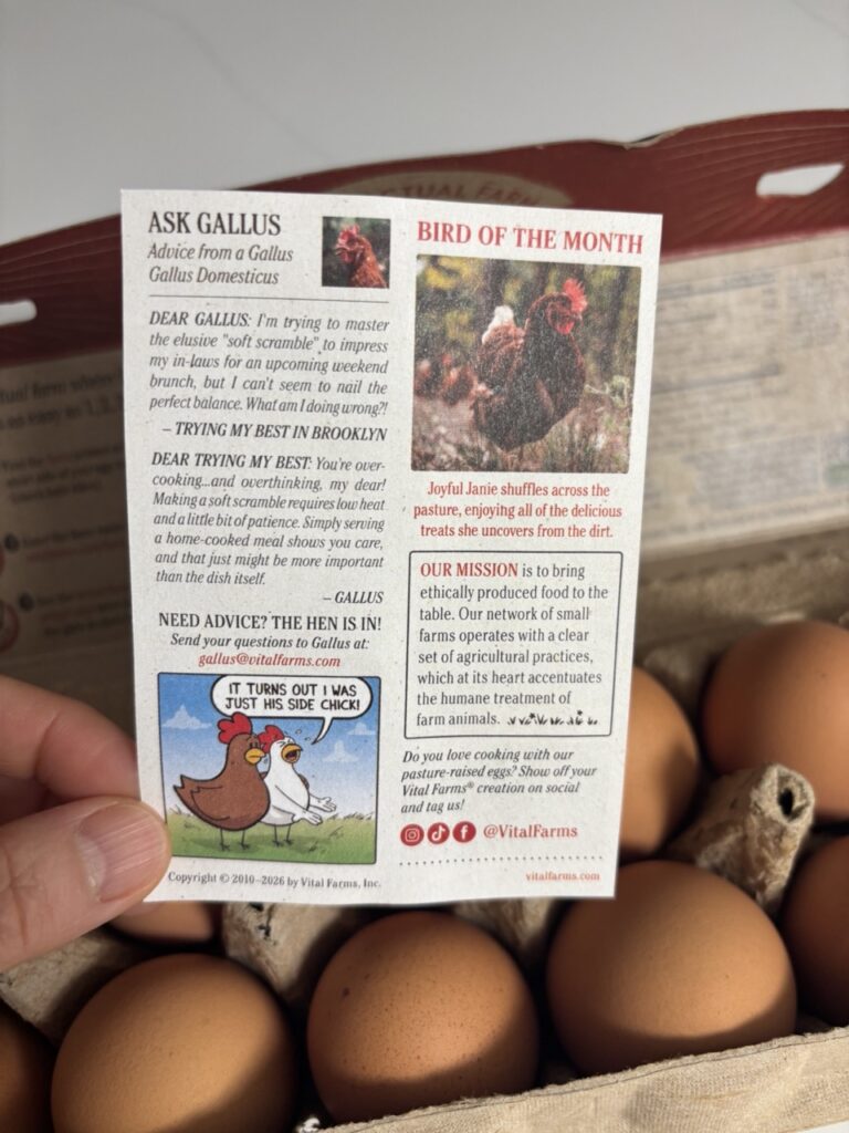 Vital Farms Pasture-Raised Organic Eggs in a black carton with Happy Hens logo