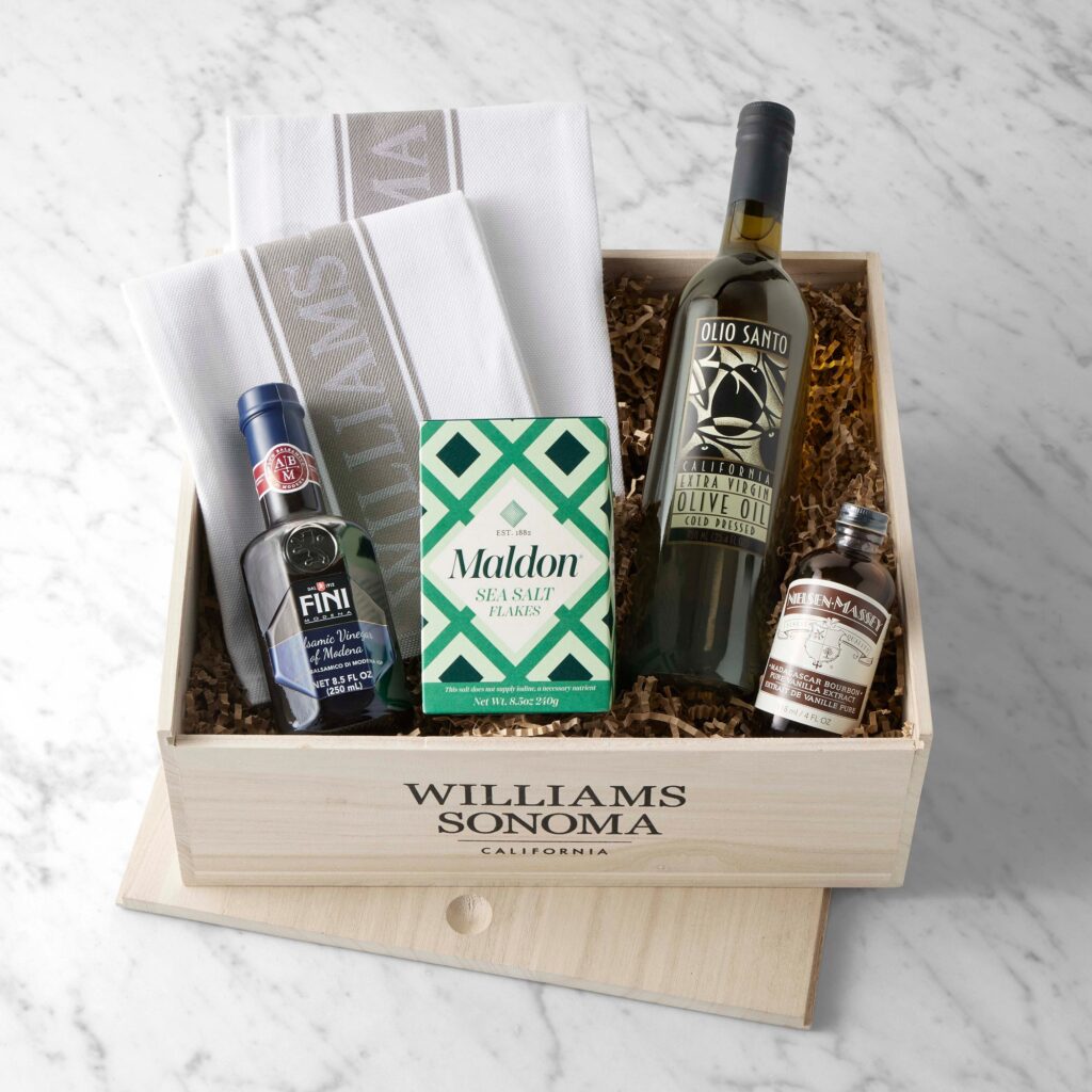 Williams Sonoma Chuck's Favorites Gift Crate with olive oil, balsamic vinegar, spices, wooden spoon and kitchen towel in a reusable wooden crate