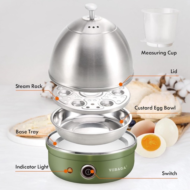 Five electric egg cookers lined up on a kitchen counter including Dash, Elite Gourmet, and VOBAGA stainless steel models