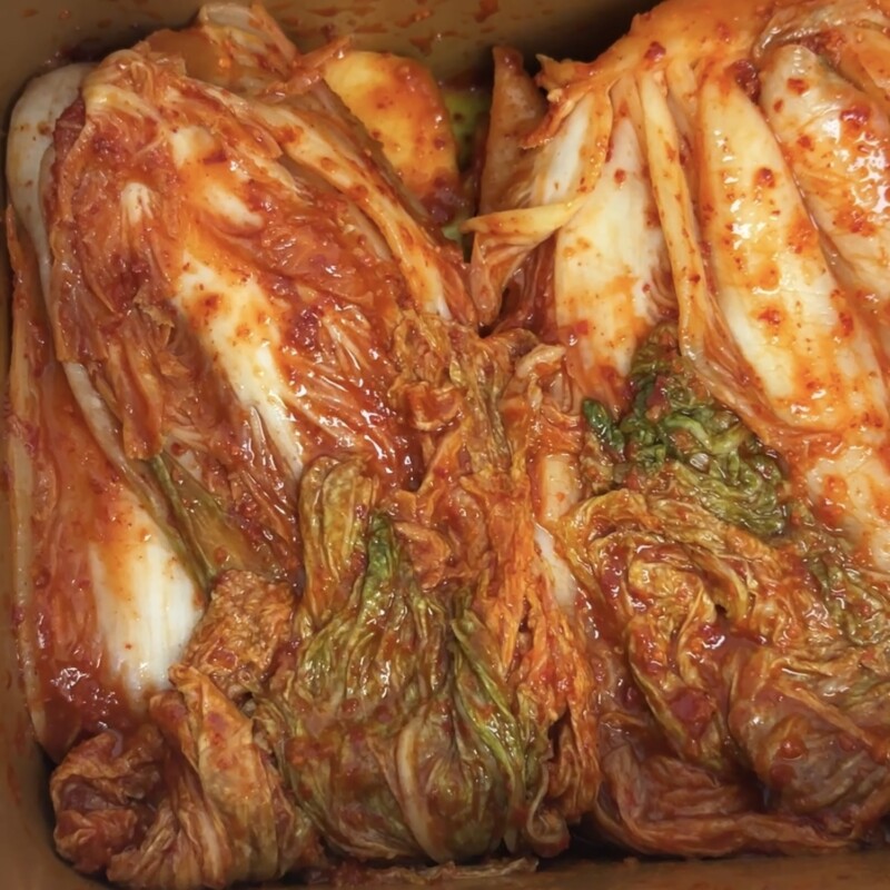 Close-up of well-fermented cabbage kimchi mixed with Jeju radish
