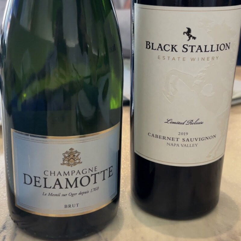 Delamotte Champagne and Black Stallion Cabernet Sauvignon on a dining table at Greek Taverna