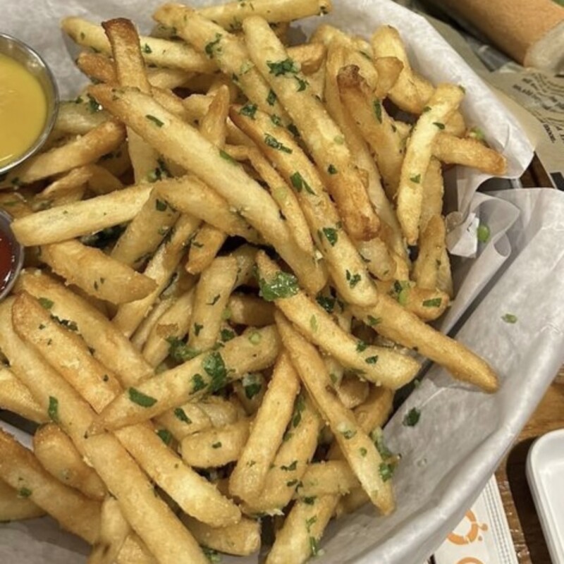 A side of golden crispy French fries at a Vietnamese restaurant